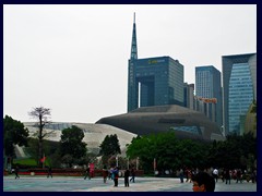 Zaha Hadid's opera house in front of CC Tower with its tall spire.